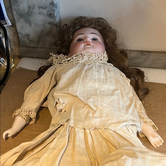 Elegant Porcelain Doll with Lace Trim